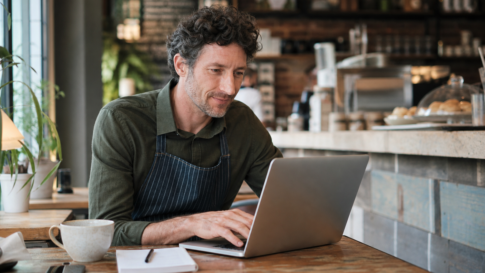 Business owner writing a thoughtful Google review reply
